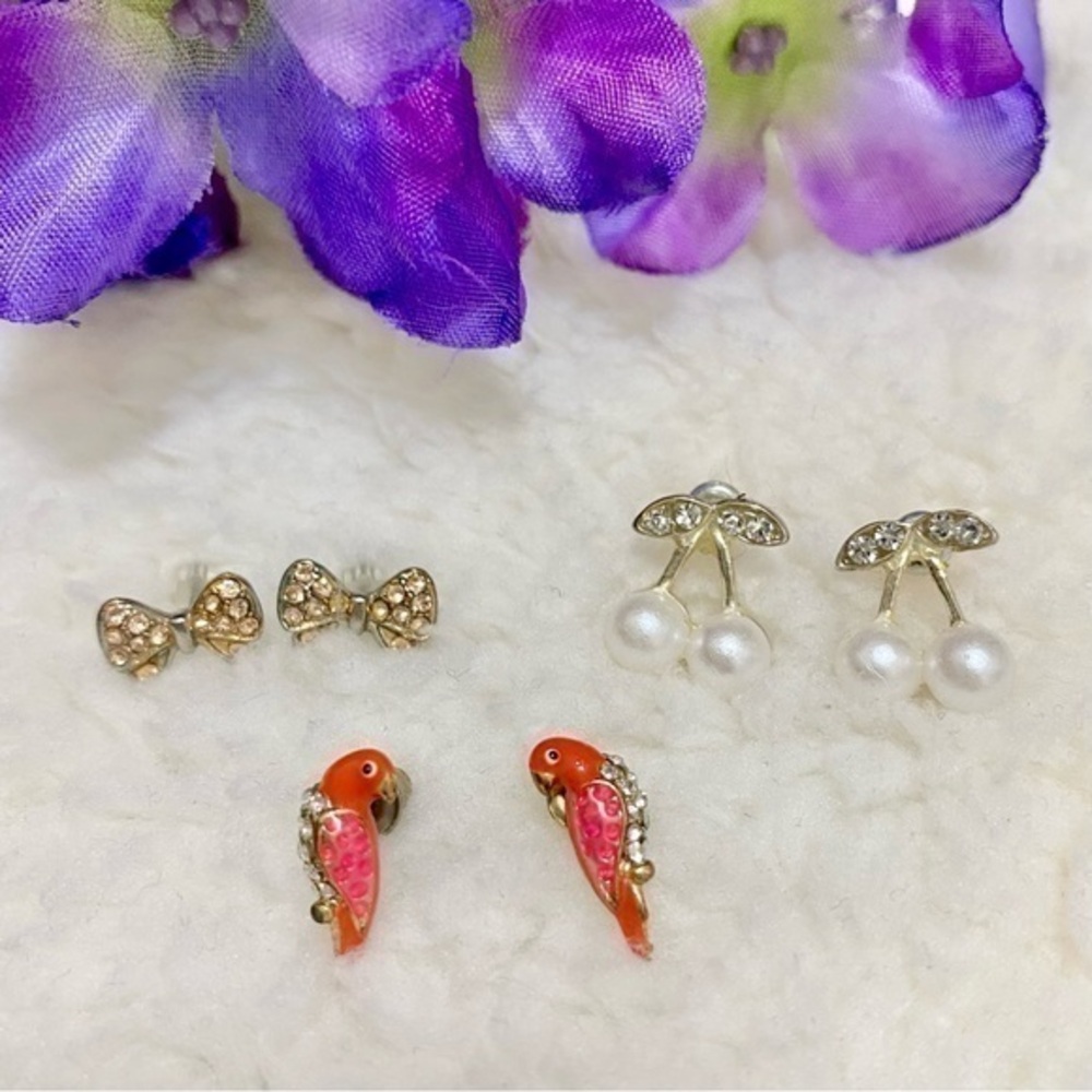 Three pair of earrings red bird , gold tone bows , and Pearl cherries
